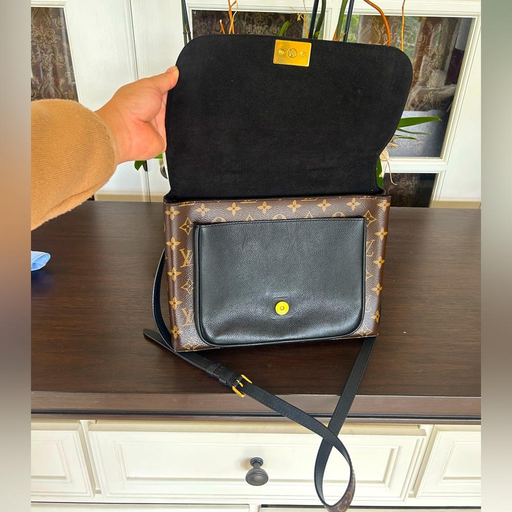 Louis Vuitton
Marignan Handbag Monogram Canvas with Leather $1600 - Picture 13 of 16